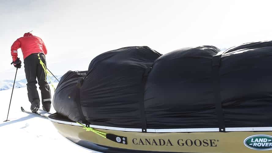 Man in skis dragging a sledge