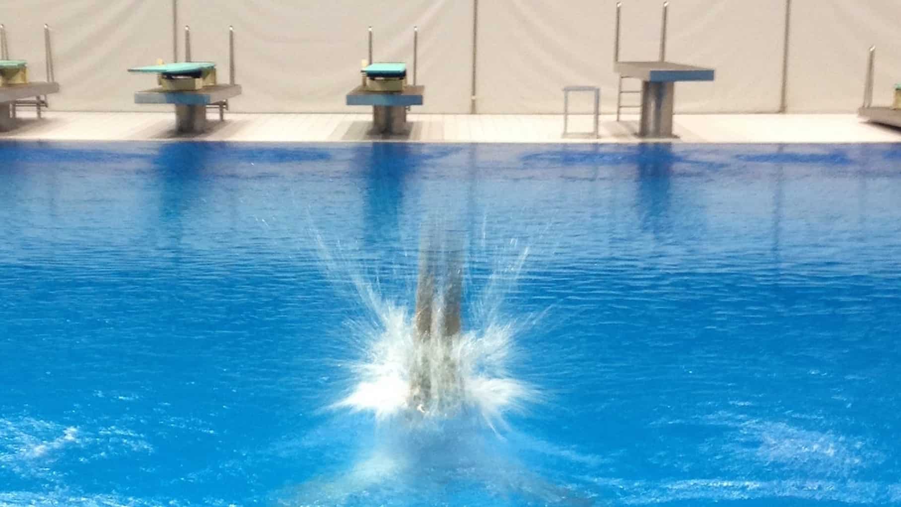 A swimming pool with blue water