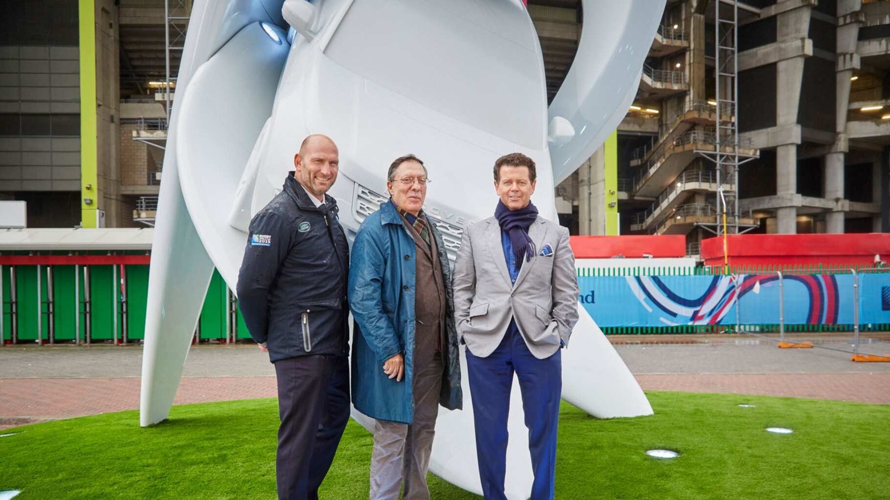 Land Rover Ambassador Lawrence Dallaglio OBE, alongside Mustica and McGovern standing in front of The Catch at Twickenham.
